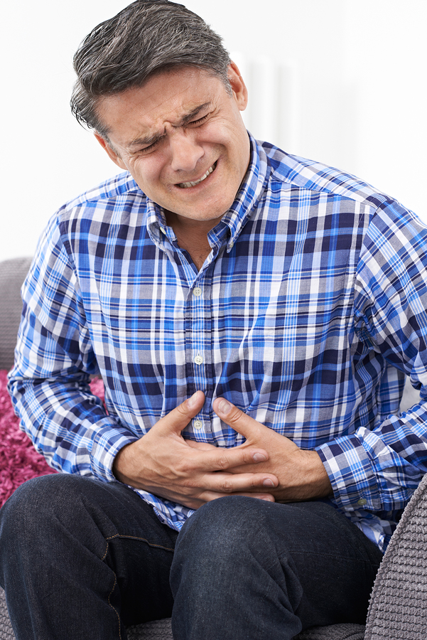 man in pain from indigestion, which fiber helps overall health, best kinds of fiber, can fiber help or hurt your health?